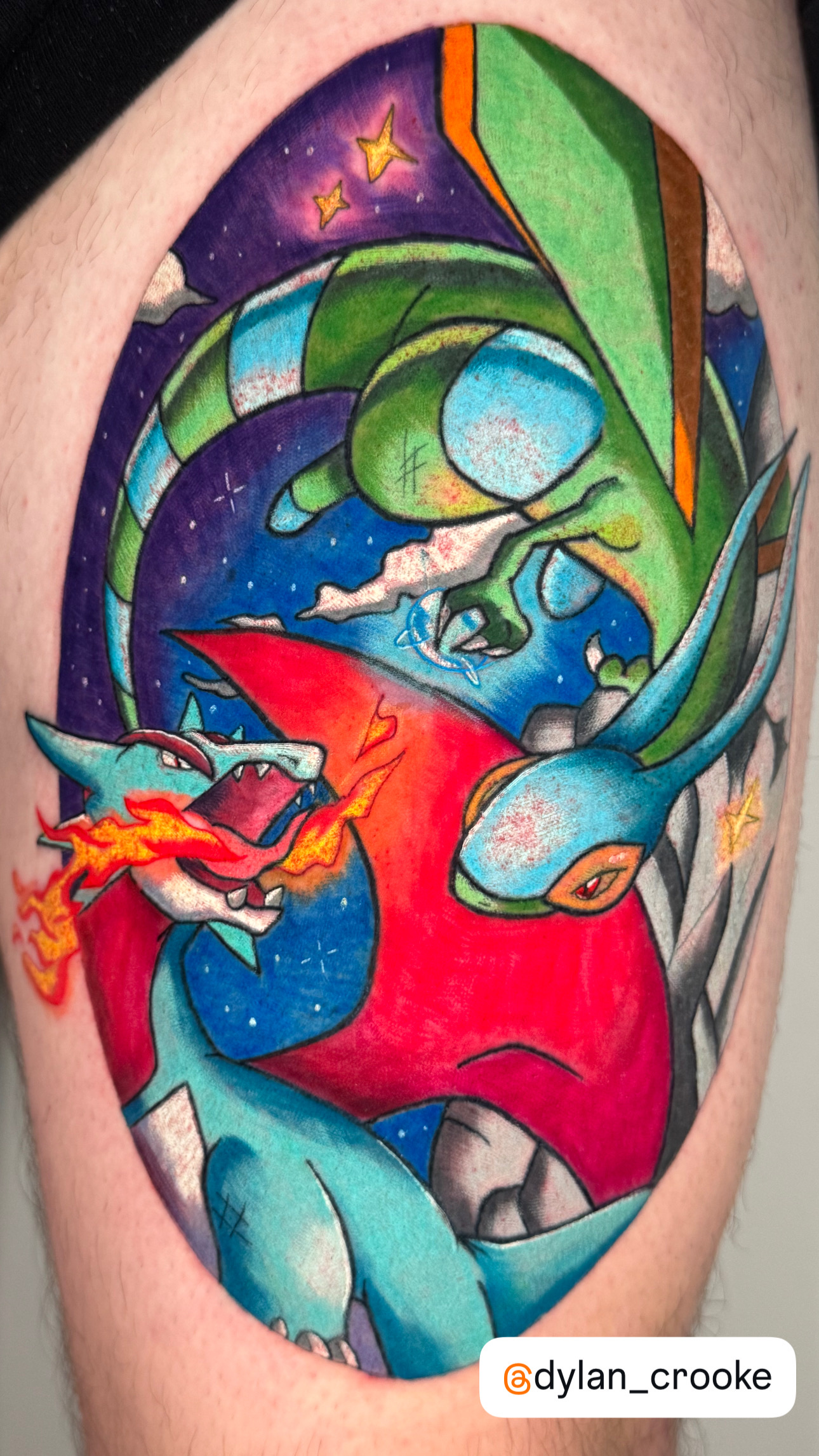 Colorful Pokémon Salamence and Rayquaza battle scene tattoo